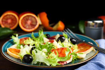 Plate of delicious sicilian orange salad on table, closeup. Space for text