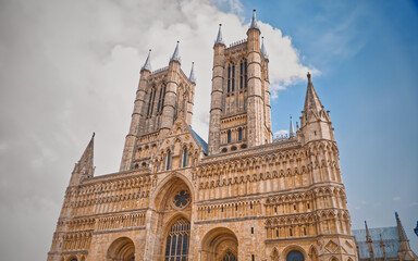 Lincoln Cathedral in Lincoln against a blue cloudy sky on a sunny day