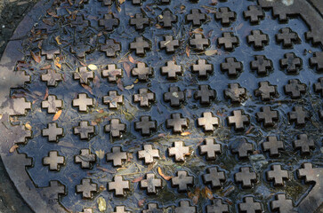 Scenic shot of a round hatchway with cross decoration
