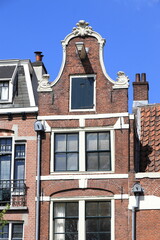 Fototapeta na wymiar Amsterdam Prinsengracht Canal Historic Brick House Facade with Bell Gable, Netherlands
