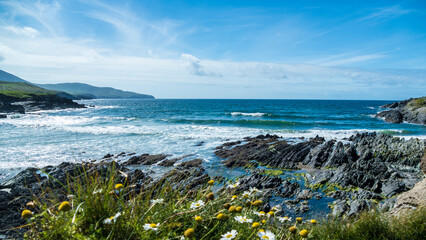 Beautiful view of the Atlantic Ocean waves hitting the rocky coast of Ireland