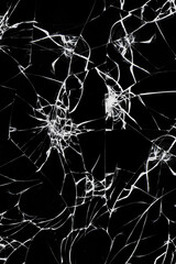 White cracks on black glass background, broken abstract glass holes, concept of breaking window or smartphone screen.
