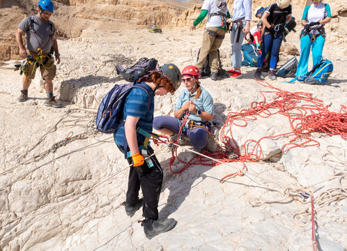 Extreme athletes are preparing to rappel in the mountains of the Judean Desert near the Tamarim stream near Jerusalem in Israel