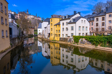 Fototapeta na wymiar Luxembourg, Luxembourg - March 28 2022 - Houses at the Alzette river from the Rue Munster
