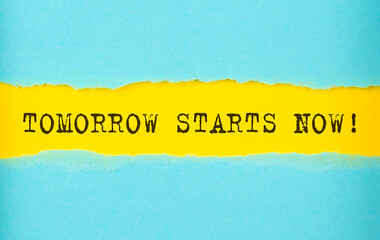 TOMORROW START NOW text on the torn paper , yellow background
