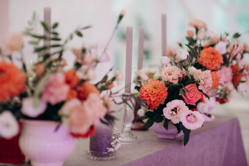 elegant flower arrangements on the reception desk of the wedding table