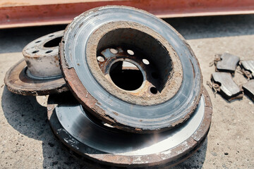 old used rusty car brake discs in bad condition
