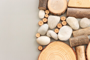 Fototapeta na wymiar Wooden logs over gray background, eco and spa concept