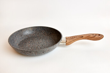 Quality frying pan made of cast iron alloy on a white background.