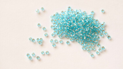 Glass beads. Light blue color. Isolated on white background.