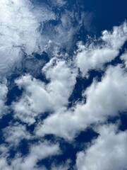 Blue sky with fluffy clouds.