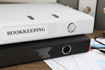 Folders and documents on desk in office, closeup. Bookkeeper's workplace
