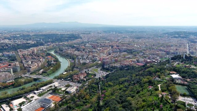 Rome urban skyline aerial view in Italy. Capital city of Italy and the Lazio region also ft panoramic view of central tennis court at Foro Italico and residential neighborhood around River Tiber in 4K