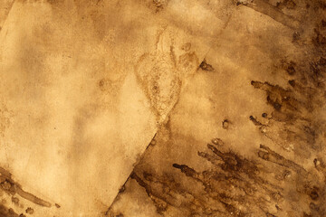 Old brown paper grunge background. Abstract liquid coffee color texture.