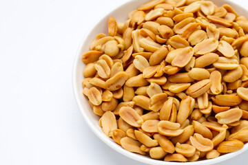 Peanut in plate on white