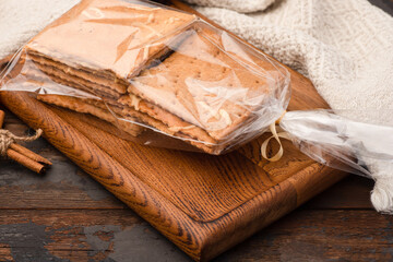 Cookies, gift-wrapped cookies, delicious gift, wooden background