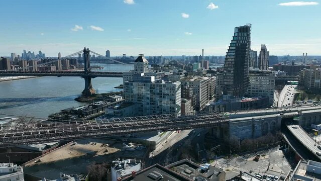 high view cars driving on and off Brooklyn Bridge Manhattan Bridge background East River New York City