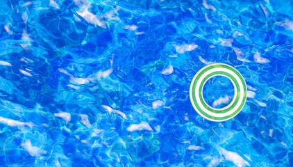 Fototapeta na wymiar Inflatable ring floating in the pool, 3d render, top view. Swimming Inflatable ring in the pool water with beautiful reflections.