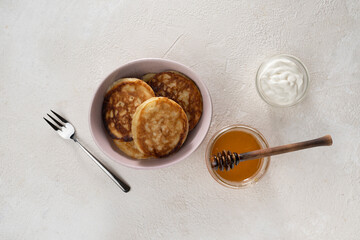 Close-up of homemade pancakes on a light table, home cooking, breakfast