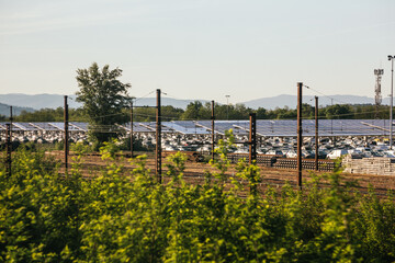 Obraz premium modern parking with solar panels, renewable energy concept