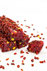 Turkish delight. Roving Turkish Delight with Pomegranate Pistachio Covered with Zereşk Grapes. Traditional Turkish cuisine delicacies. close up