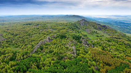 Fototapeta na wymiar The Southern Urals in spring, the border of Europe and Asia - Irendyk ridge, Mountain of volcanic origin Yanguziai.