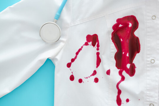doctors coat stained with red liquid - uniform stained with blood