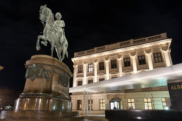 Evening view to Erzherzog Albrecht equestrian monument near famous Albertina museum palace in...