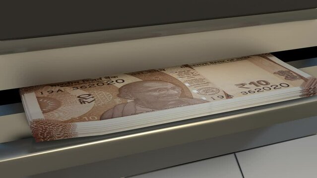 10 Indian rupees  in cash dispenser. Withdrawal of cash from an ATM. Financial transaction in the bank terminal. INR.