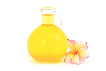 Plumeria flower and oil isolated on white background.