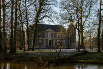 Obraz premium Backside of Hackfort castle with stronghold tower and white facade of quarters in park surrounding