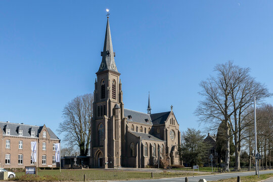 Clear blue sky behind Catholic Antoniuskerk church and statue museum next to Dutch National Trauma Center headquarters in historic mansion PTSD treatment institution