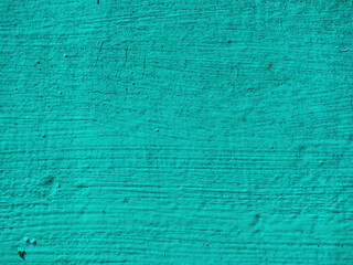 Abstract textured turquoise background. Rough painted surface of blue-green  (aquamarine) color