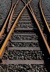 Railway switch with rusty steel, screws, fixings, concrete thresholds, gravel and technical details...