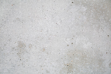 Heterogeneous gray concrete background with inclusions, close-up