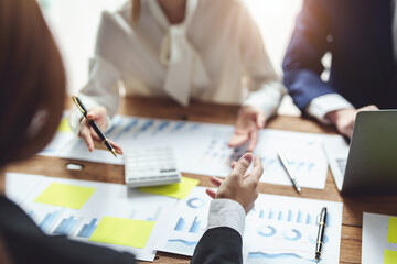 financial, Brainstorming, Consulting, Data Analysis, Planning, Marketing and Accounting, Economist pointing to investment documents with partners on profit taking to compete with other companies.