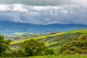 View of a valley with storm clouds in the sky