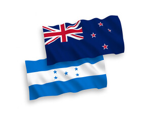 National vector fabric wave flags of New Zealand and Honduras isolated on white background. 1 to 2 proportion.