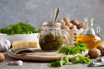 Homemade pesto made from ground elder leaves in spring, oil, parmesan cheese and walnuts