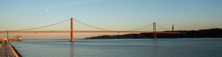 Fototapeta na wymiar Lisbon, Portugal - november 14 2022 - Bridge of april 25th (Ponte 25 de Abril) crossing the Duoro river