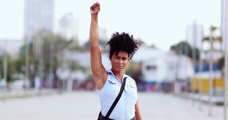 Female political activist raising fist in the air