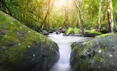 Thao To Waterfall. river background with small waterfalls in tropical forest.It flows from the rainforest mountain in the mountains of Nong Bua Lam Phu in Thailand is a beautiful landscape.