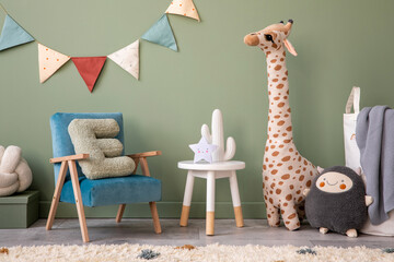 Creative composition of stylish and cozy child room interior design with green wall, plush toys,...