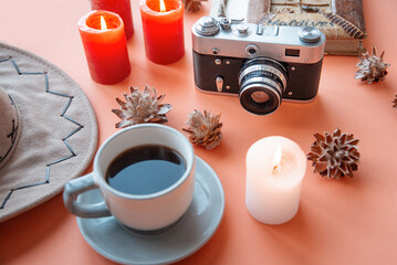 old camera. coffee hat, travel accessories orange background. tourist tour