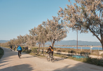 APRIL 2022 - cagliari - ITALY biker with mountain bike or mtb crossing the old bridge in The Park...