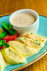 Dumplings di patate with basil and tomato sauce