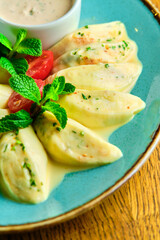 Dumplings di patate with basil and tomato sauce