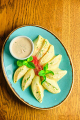 Dumplings di patate with basil and tomato sauce