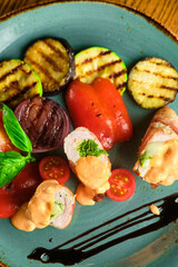 Fried pork rolls stuffed with prunes, wrapped in bacon,