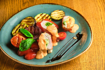 Fried pork rolls stuffed with prunes, wrapped in bacon,